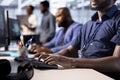 Diverse team of developers in data center identifying errors