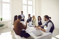 Diverse team of happy business people laughing at something during a work meeting Royalty Free Stock Photo