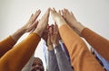 Diverse team of happy business people raising their arms and joining their hands Royalty Free Stock Photo