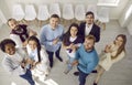 Diverse team of happy business people standing together, smiling and clapping hands Royalty Free Stock Photo