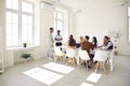 Diverse team of happy young business people having a meeting in an office interior Royalty Free Stock Photo