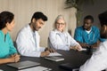 Diverse team of medical professionals making business decision Royalty Free Stock Photo