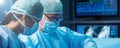 Diverse team of professional medical surgeons perform surgery in the operating room using high-tech equipment. Doctors