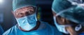 Diverse team of professional medical surgeons perform surgery in the operating room using high-tech equipment. Doctors Royalty Free Stock Photo
