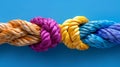 Diverse team strength in colorful network rope, integration of cooperation and empowerment. Royalty Free Stock Photo