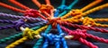 Diverse team unity and partnership concept with colorful braided rope background Royalty Free Stock Photo