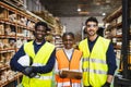 Diverse team of workers smiling in lumberyard warehouse Royalty Free Stock Photo