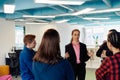 A diverse team of young business people exchanging ideas in a modern startup office Royalty Free Stock Photo