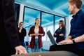 A diverse team of young business people exchanging ideas in a modern startup office Royalty Free Stock Photo
