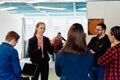 A diverse team of young business people exchanging ideas in a modern startup office Royalty Free Stock Photo