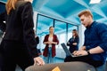 A diverse team of young business people exchanging ideas in a modern startup office Royalty Free Stock Photo