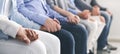 Diverse Unrecognizable People Holding Hands, Supporting Each Other During Therapy Session