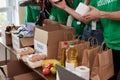 Diverse volunteers collecting food and clothes donations in warehouse Royalty Free Stock Photo