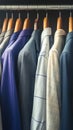 Diverse wardrobe Hanging colorful mens suits in a closet Royalty Free Stock Photo