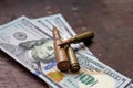 Diverse weapon bullets on American dollars background. Military industry, war, global arms trade and crime concept. Royalty Free Stock Photo