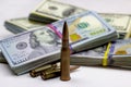 Diverse weapon bullets on American dollars background. Military industry, war, global arms trade and crime concept Royalty Free Stock Photo