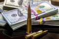 Diverse weapon bullets on American dollars background. Military industry, war, global arms trade and crime concept. Royalty Free Stock Photo