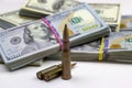 Diverse weapon bullets on American dollars background. Military industry, war, global arms trade and crime concept. Royalty Free Stock Photo