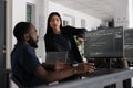 Diverse web developers working on software development with source code