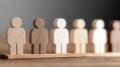 Diverse wooden figures symbolizing unity and equality, collaborating for a better society. Royalty Free Stock Photo