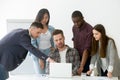 Diverse work team working together at laptop during meeting Royalty Free Stock Photo