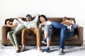 Diverse workers taking rest on couch Royalty Free Stock Photo