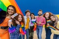 Diverse young adult friends celebrating gay pride parade festival day Royalty Free Stock Photo