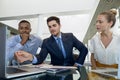 Diverse young business colleagues working together at desk Royalty Free Stock Photo