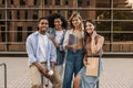 Diverse young classmates walking after class on campus, looking at camera. Royalty Free Stock Photo