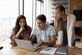 Diverse colleagues work together on laptop in office Royalty Free Stock Photo