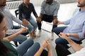Diverse young people hold hands participate in group therapy Royalty Free Stock Photo