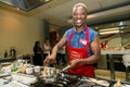 Diverse young people learning to cook and bake at a cooking class Royalty Free Stock Photo