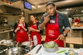 Diverse young people learning to cook and bake at a cooking class Royalty Free Stock Photo