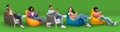 Diverse Young People Relaxing Using Smartphones While Sitting In Armchairs At Home Royalty Free Stock Photo