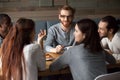 Diverse young people talking and having fun together in cafe Royalty Free Stock Photo