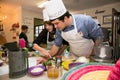 Diverse young people at team building cooking class