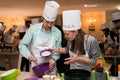 Diverse young people at team building cooking class