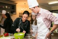 Diverse young people at team building cooking class