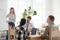 Diverse young team at conference in boardroom