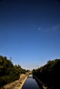 Diversionary channel in the countryside on a clear day at sunset