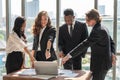 Diversity Business and Work concept. Group of businessman and businesswoman team colleague meeting and pointing to laptop computer Royalty Free Stock Photo