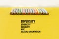 Diversity concept. row of mix color pencil on yellow background with text Diversity, Ethnicity, Equality, Age, Sexual Orientation Royalty Free Stock Photo