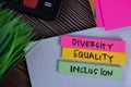 Diversity Equality Inclusion write on a sticky note isolated on Office Desk Royalty Free Stock Photo
