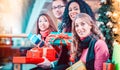 Diversity Friends with Christmas presents and bags shopping in m Royalty Free Stock Photo