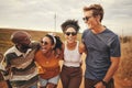 Diversity, friends and on countryside holiday smile, relax and happy together on dirt road trip. Group excited, on Royalty Free Stock Photo