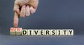 Diversity or neurodiversity symbol. Concept words Diversity and Neurodiversity on wooden cubes. Doctor hand. Beautiful grey