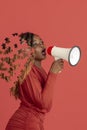 Creative collage of young african woman talking in megaphone. Female head consist of puzzle pieces