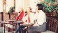 Diversity People Connection Digital Devices Browsing. Social Networking at Cafe. three girls in cafe speaking on phone Royalty Free Stock Photo