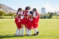 Diversity, sports girl hug and soccer field training for youth competition match playing at stadium grass. Team, young Royalty Free Stock Photo