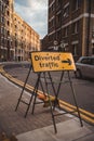 Diverted traffic yellow sign on the road in Central London